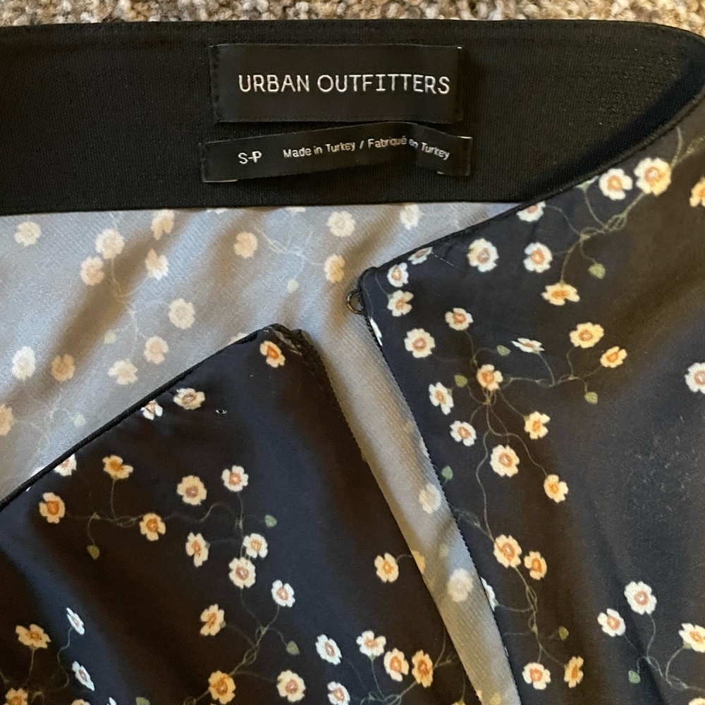 Urban Outfitter skirt. Black with tiny white/beige flowers. Size small